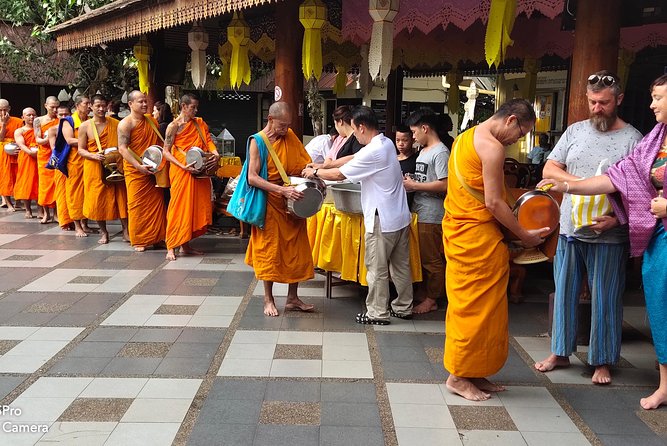 4 highlights: Sticky Waterfall/Elephants/local market /Wat Banden - Sticky Waterfalls: walking, splashing, and Thai massage-style fun in the water