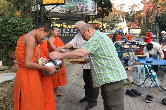 Alms and Wat Phra That Doi Suthep Private Chiang Mai Tour - Wat Phra That Doi Suthep: mountaintop temple views, cable car included