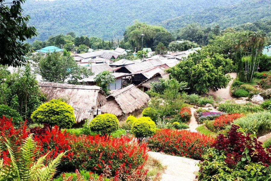 Chiang Mai: Doi Suthep and Hmong Village Half-Day Tour - Wat Phra That Doi Suthep: steps, tram, and the legend layer
