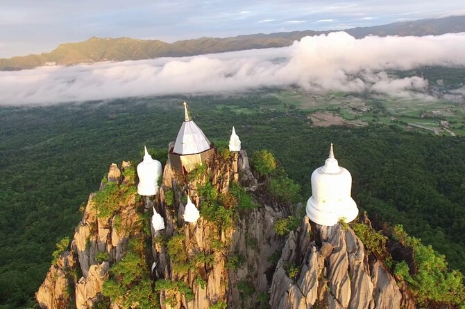 Chiang Mai Exotic Excursion Unseen Miracle of Faith To Pupadang Lampang Temple - Stop 2: Wat Phra Bat Pu Pha Daeng, climb higher for respect and prosperity prayers