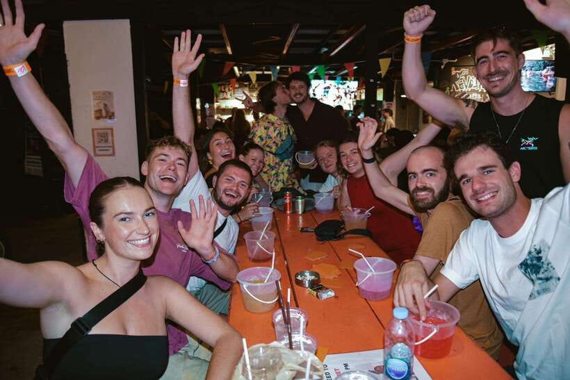Chiang Mai Pub Crawl: The Best Nightlife in Town! - Where to start: Revolution Hostel sign and the red truck pickup