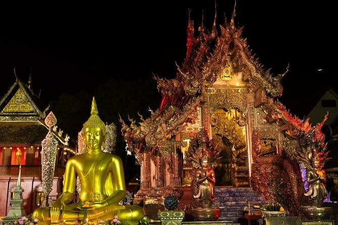 Chiang Mai Temples and Market Tuk Tuk Night Tour - Wat Chedi Luang Varavihara: dramatic stupa ruins under temple lights