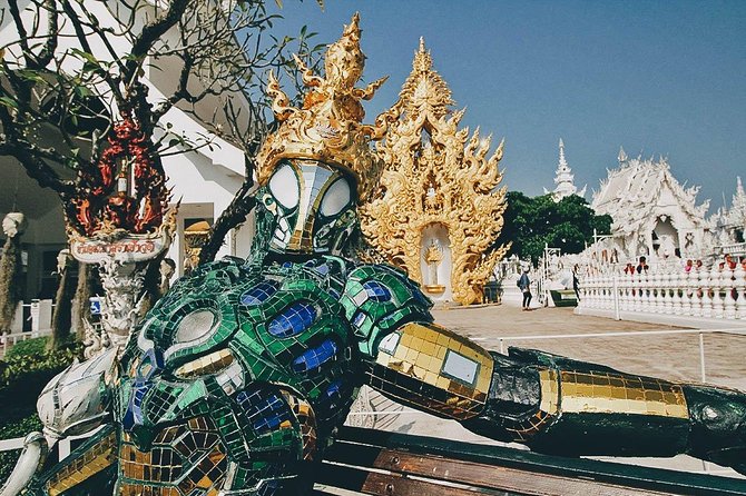 Chiang Rai in a Day: Hot Spring,White Temple,Golden Triangle,Yao&Akha Hilltribe - Wat Rong Khun: White Temple’s Glass, Symbols, and Opinions