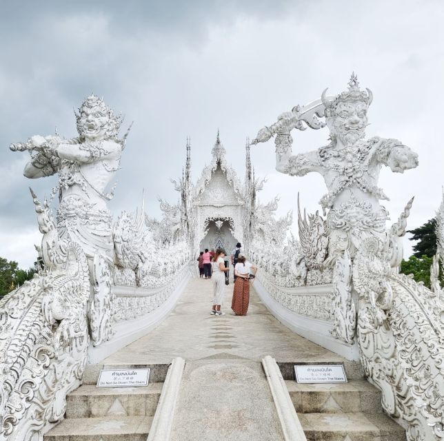 From Chiang Mai: Chiang Rai's Temples Exploration Day Trip - Wat Rong Khun, White Temple mirror effects and spiritual symbolism