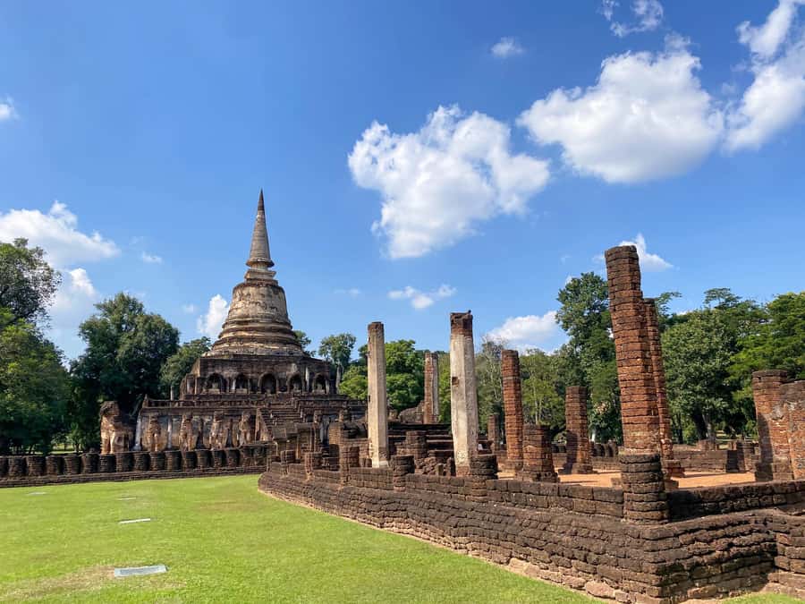 From Chiang Mai: Customize Your Own Sukhothai Heritage Tour - Wat Traphang Ngoen: Buddha on a pedestal with pond views