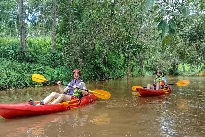 No.1 Full-Day Chiang Mai Caving & Jungle Kayaking: Chiang Dao - Chiang Dao Cave complex: headlamps, Buddhist shrines, and tight crawl sections
