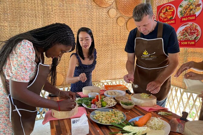 Team Aim Thai Cooking School (#1 Cooking Class in Chiang Mai) - The open-air kitchen setup that keeps you active