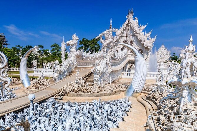 White, Red/Black and Blue Temples Full Day Trip From Chiang Mai - Wat Rong Seur Ten (Blue Temple): More Time for Photos, Still a Crowd Magnet